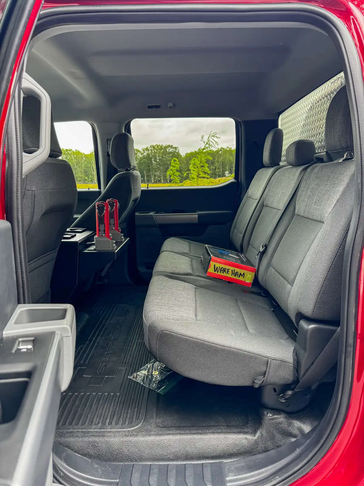 Rear console base close-up showing mounting bracket and floor area.